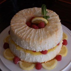 Lemon Angel Food Cake Filled With Lemon Curd and Fresh Raspberry