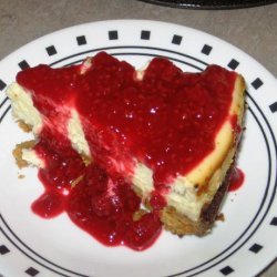 Luscious Lemon Cheesecake With Raspberry Sauce