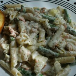 Salmon Penne With Basil Pesto Cream Sauce, Artichokes, and Asparagus