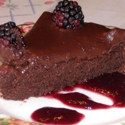 Decadent Chocolate Cake on a Bed of Raspberry Sauce