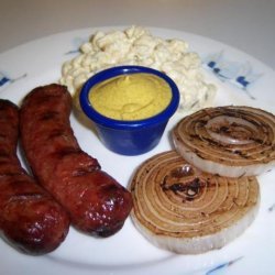 Brats With Glazed Red Onions