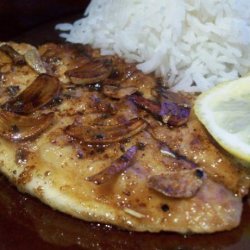 Sauted Fish Fillets With Sliced Garlic and Butter Sauce