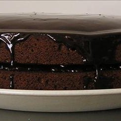 Chocolate  Cake Dripping With Chocolate Sauce
