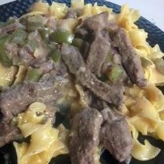 Steak Grillades over Cheese Noodles