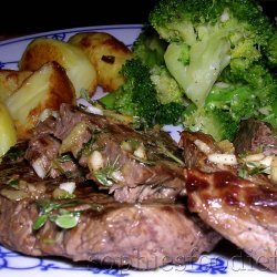 Grilled Steak with Roasted Garlic and Herbs