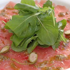 Tuna Carpacio With Basil Oil Lemon And Caper Berri...