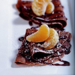 Chocolate Crepes With Tangerines And Dark Chocolat...