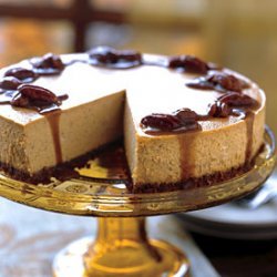 Spiced Pumpkin Cheesecake with Caramel-Bourbon Sauce