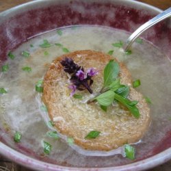 Garlic Soup With Toasted Croutons Basil And Red Ch...