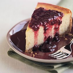 Orange Blossom Cheesecake with Raspberry and Pomegranate Sauce