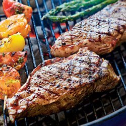 Peppercorn-Crusted Strip Steaks with Seasoned Butter