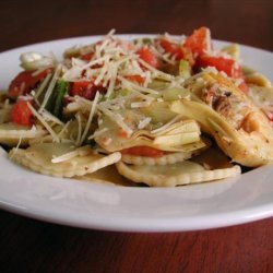 Cheese Ravioli With Fresh Tomato and Artichoke Sauce